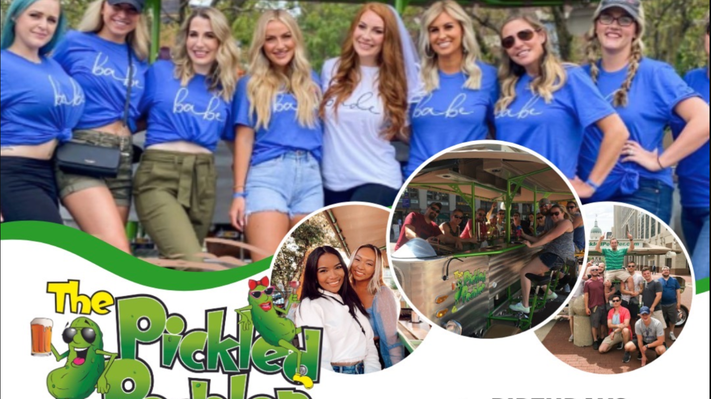 a group of people standing in front of a crowd posing for the camera